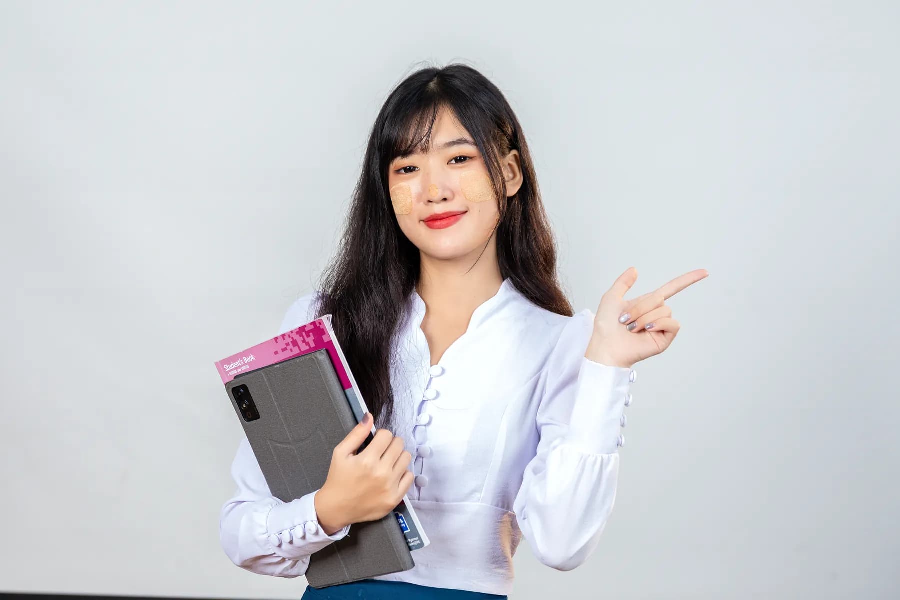 Nura Dev learner holding study materials